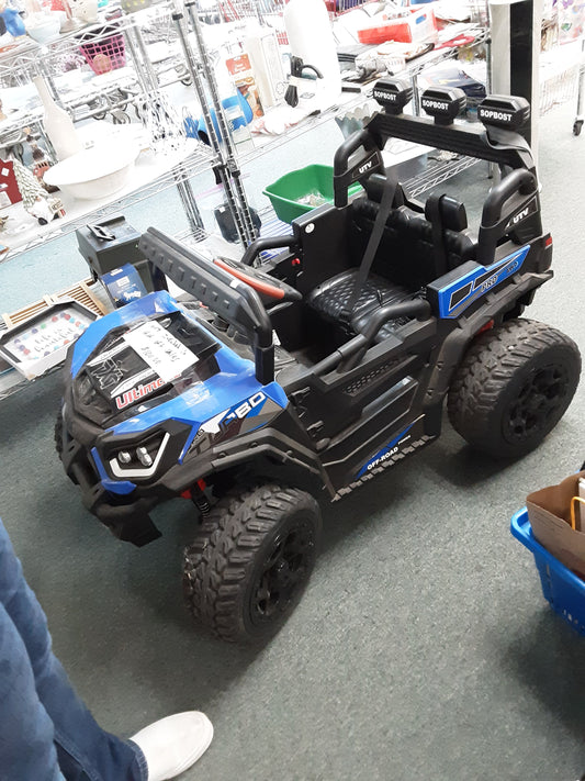 Ride on jeep with "radio" music with bluetooth.  Has charger & key.  WORKS